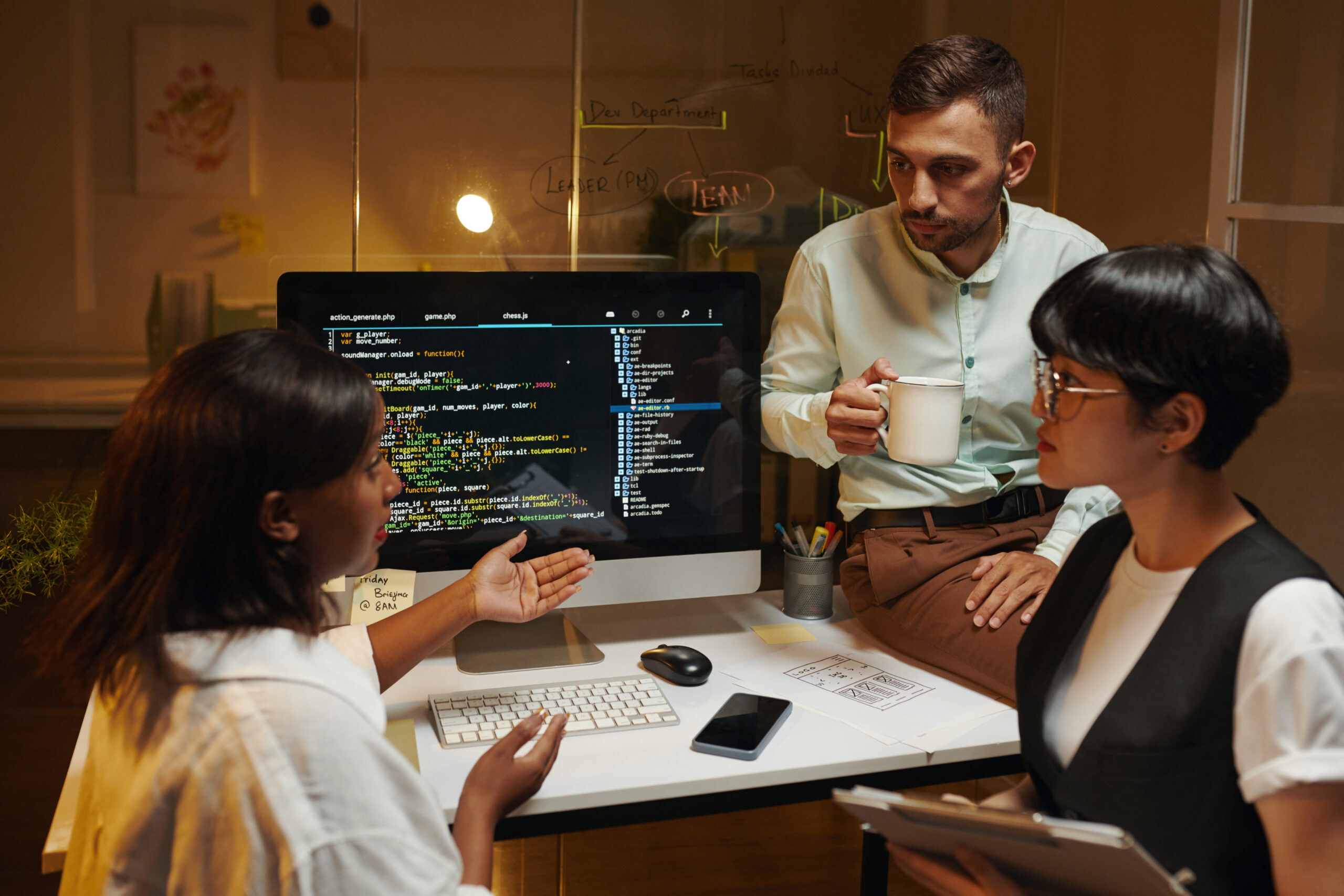 Team leader talking to coworkers about problems with programming code
